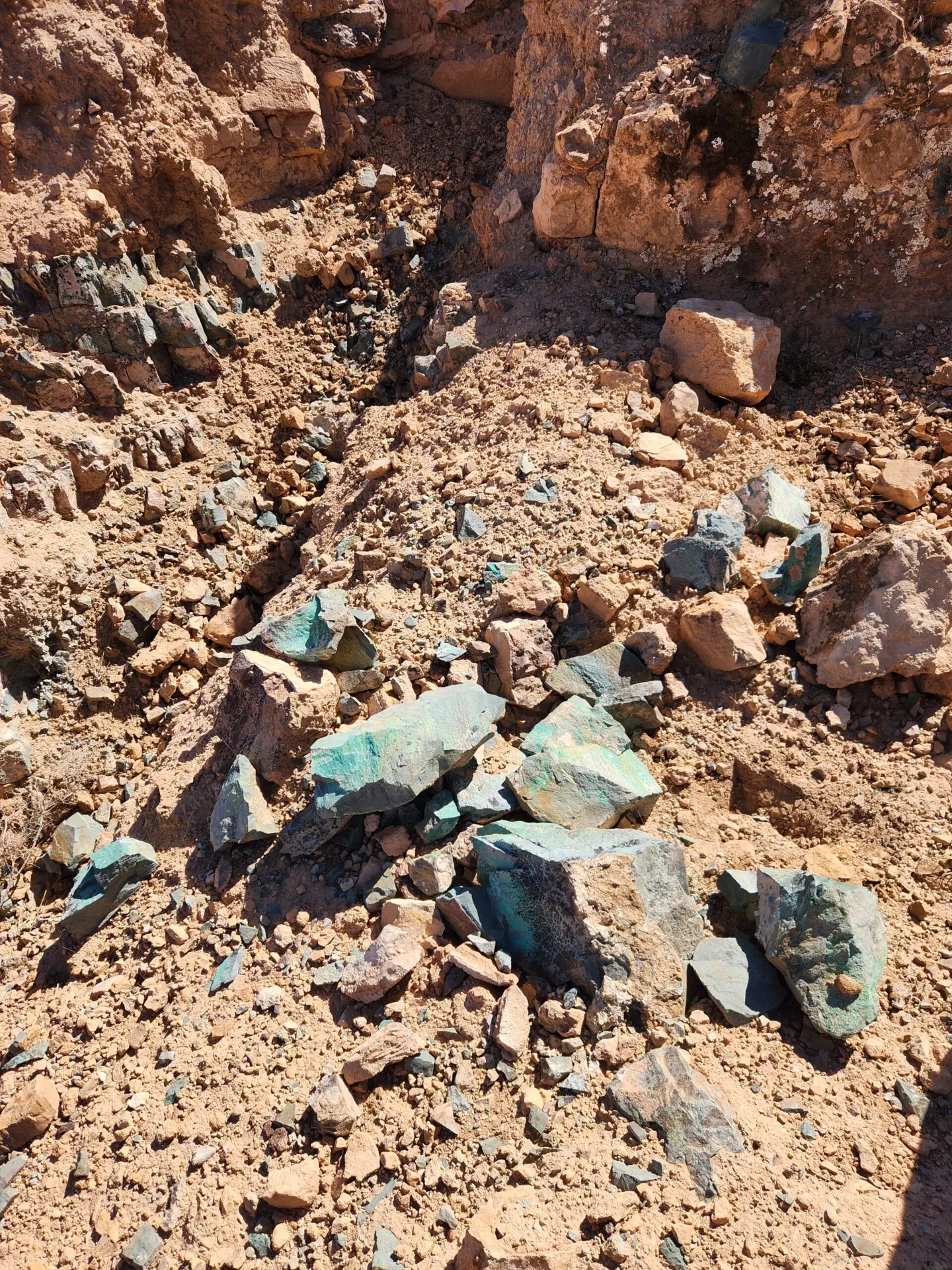 Copper-stained malachite outcrop and rubble at a Talisman exploration site in Morocco
